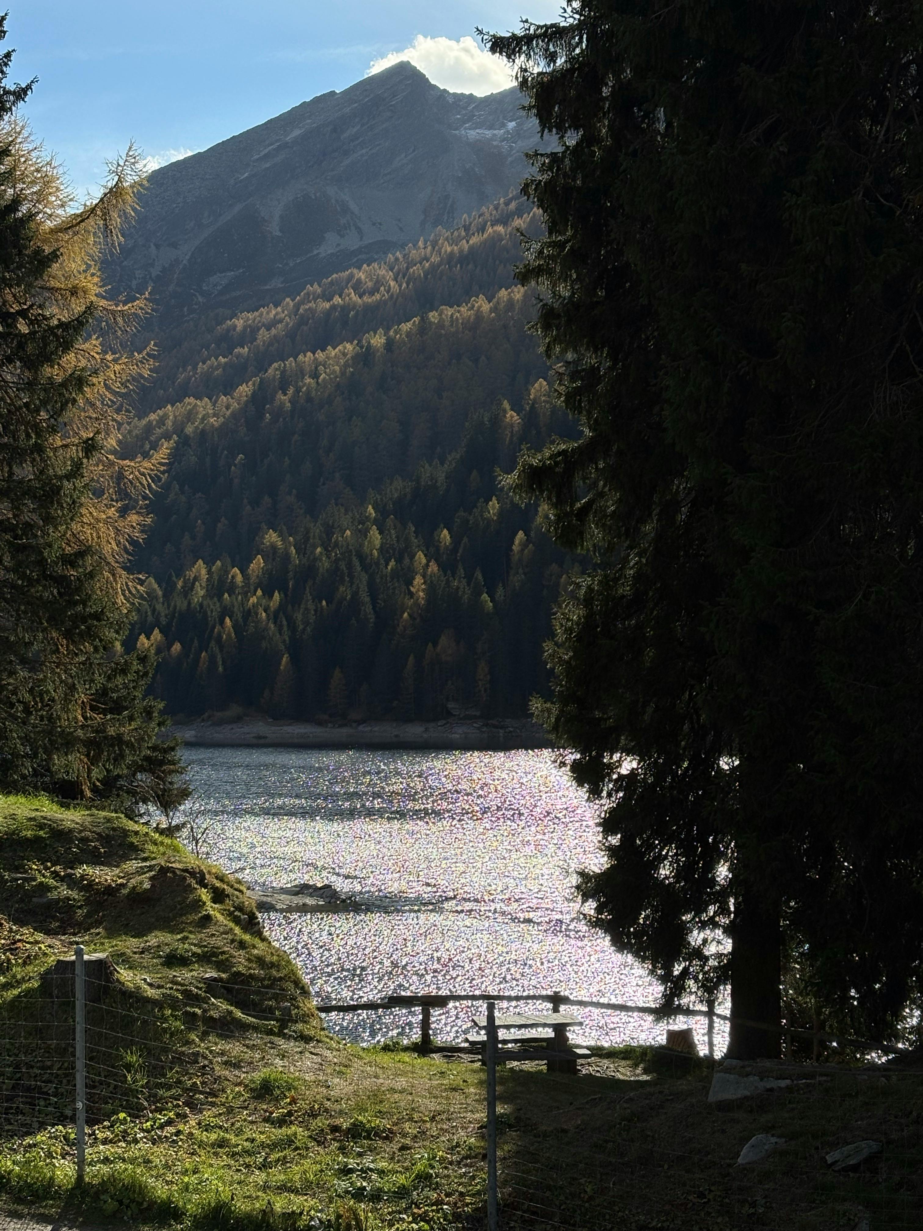 Free Peaceful autumn landscape with a mountain lake and colorful trees. Stock Photo