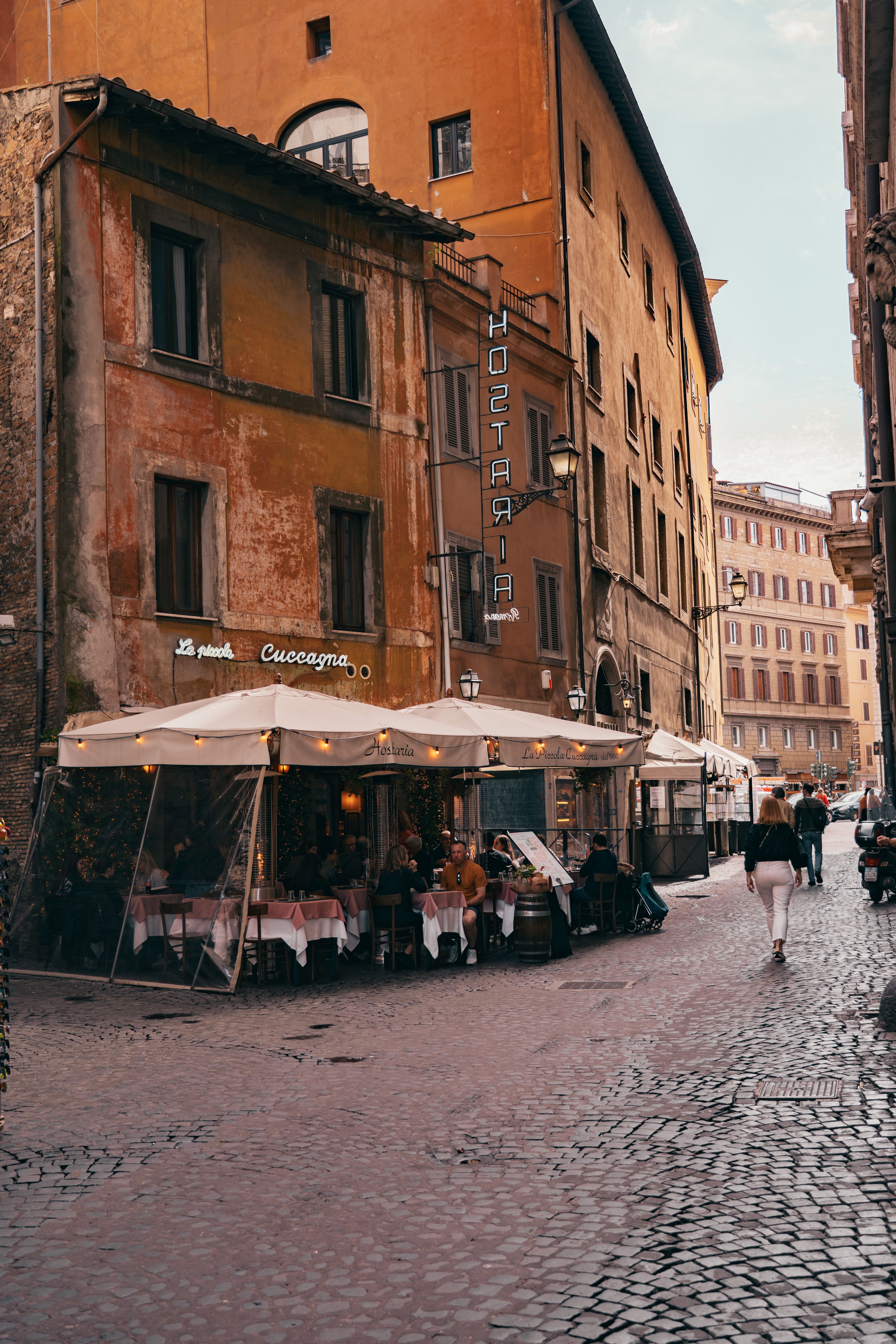 Charming Street Scene in Historic Rome with Outdoor Cafe · Free Stock Photo