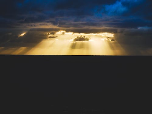 Free Dark Clouds with Sunbeams Stock Photo