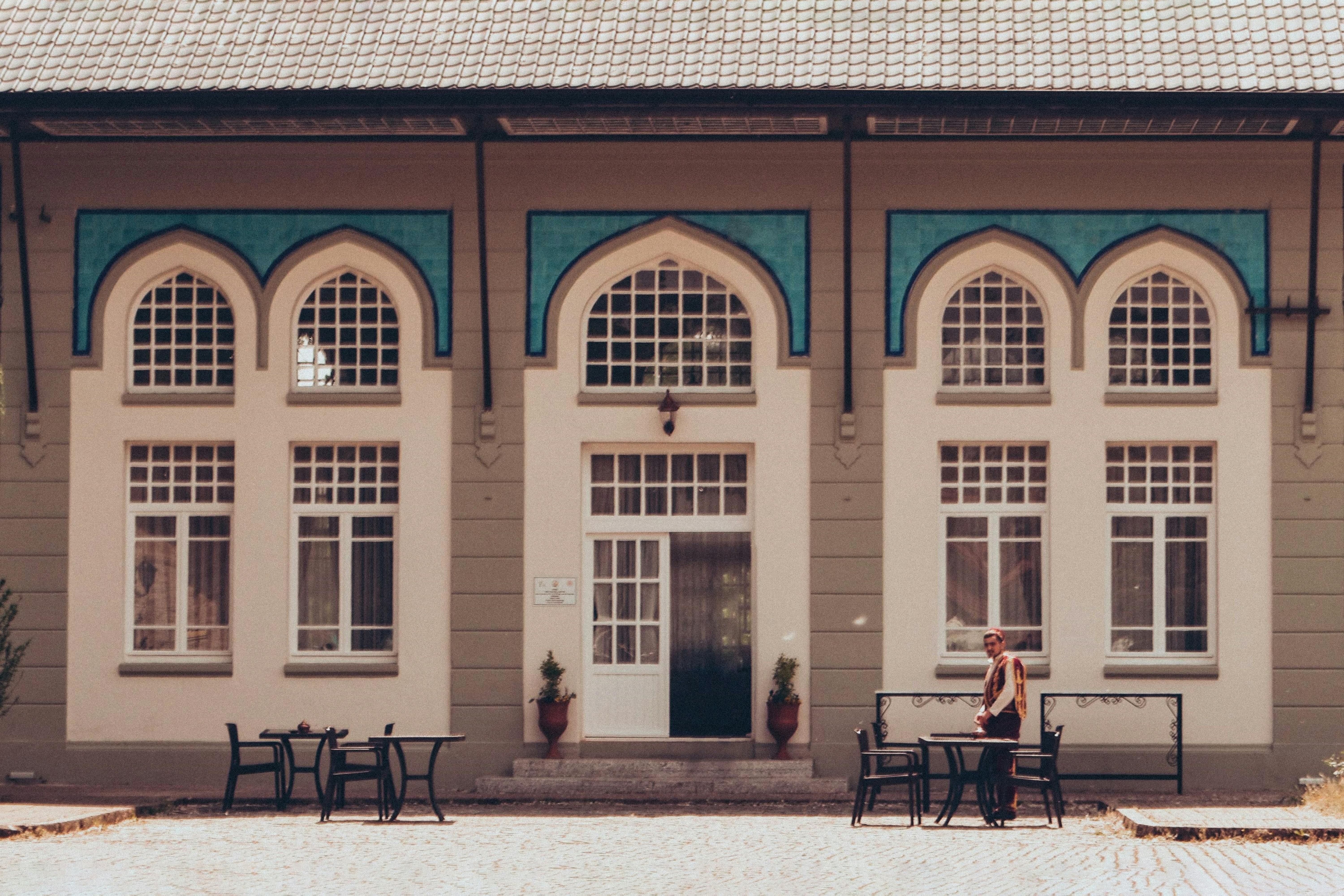 Free A person stands in front of a historic Ottoman-style building in Karaağaç, Edirne. Stock Photo