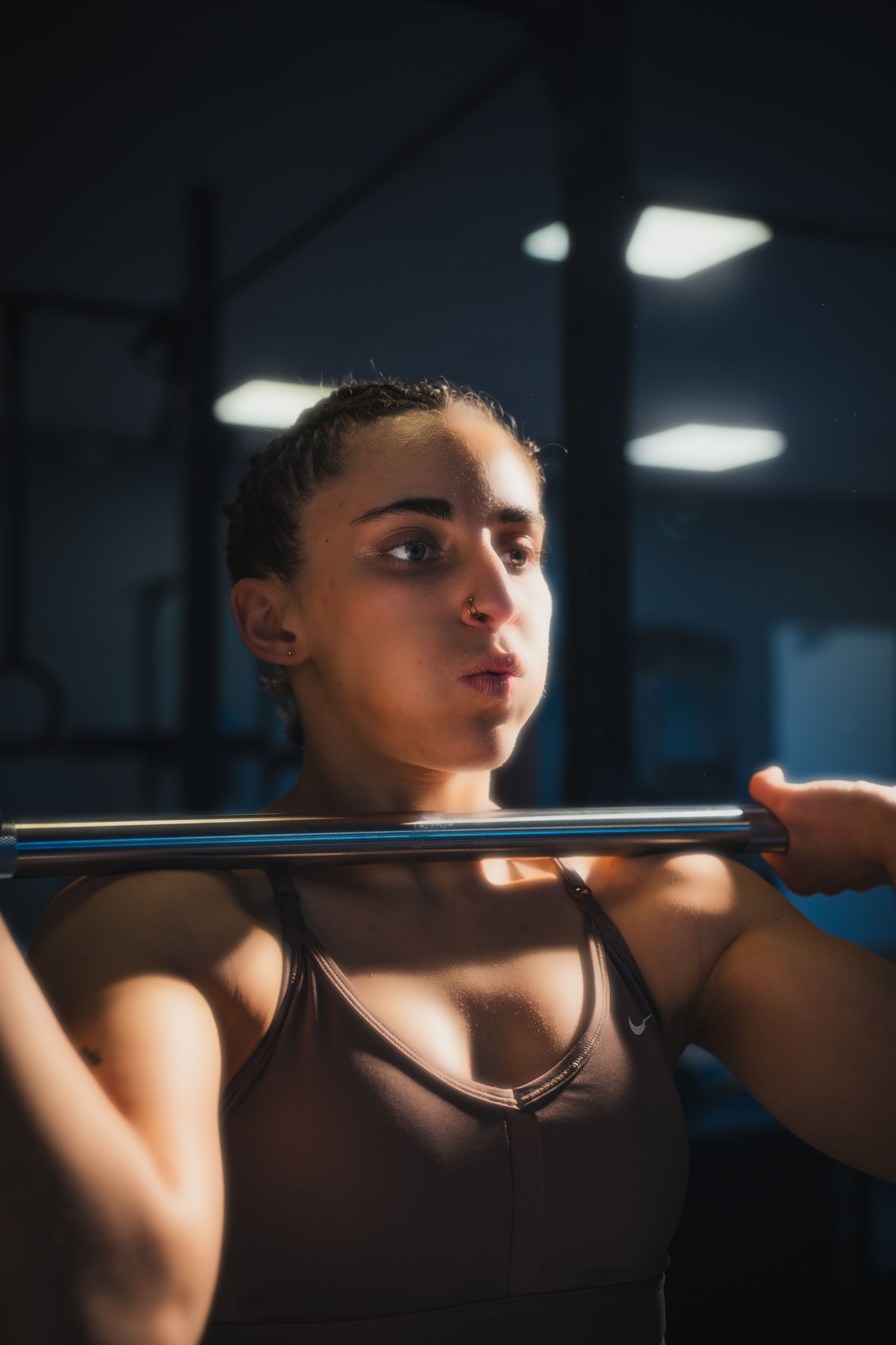 Female Athlete Lifting Weights in Gym · Free Stock Photo