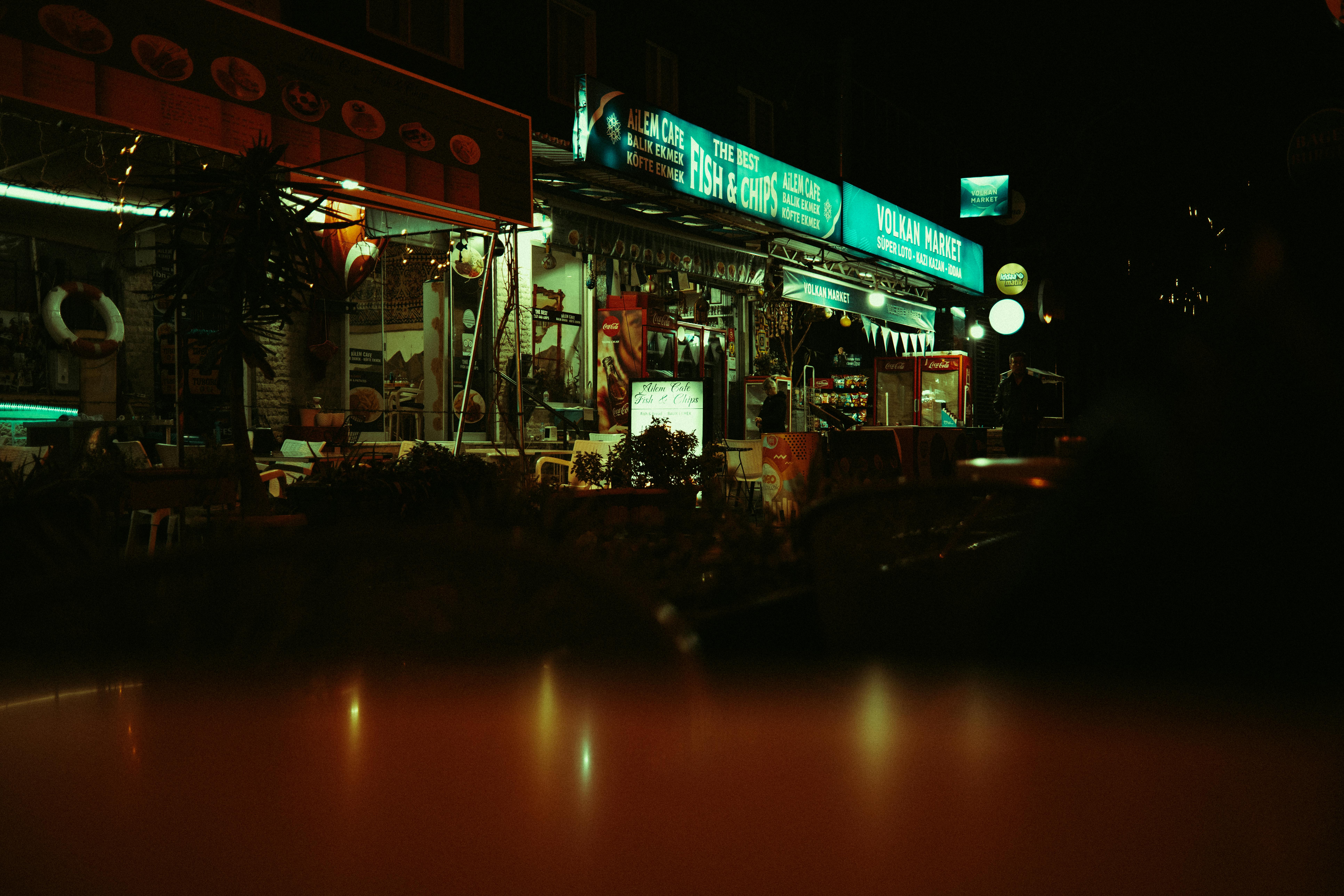 Free Explore the vibrant, illuminated market at night, showcasing lively storefronts and neon signs. Stock Photo