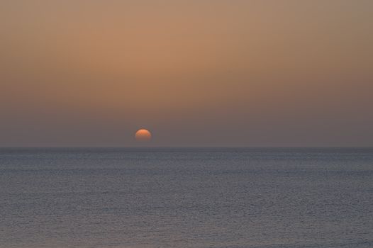 A tranquil sunrise over the Atlantic Ocean near the Canary Islands, Spain.