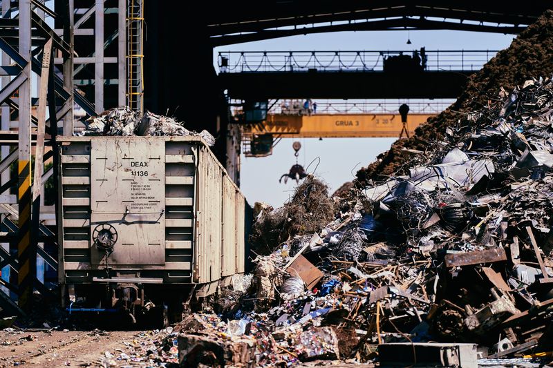 Industrial scrap yard train car and crane — Scrap India Mart