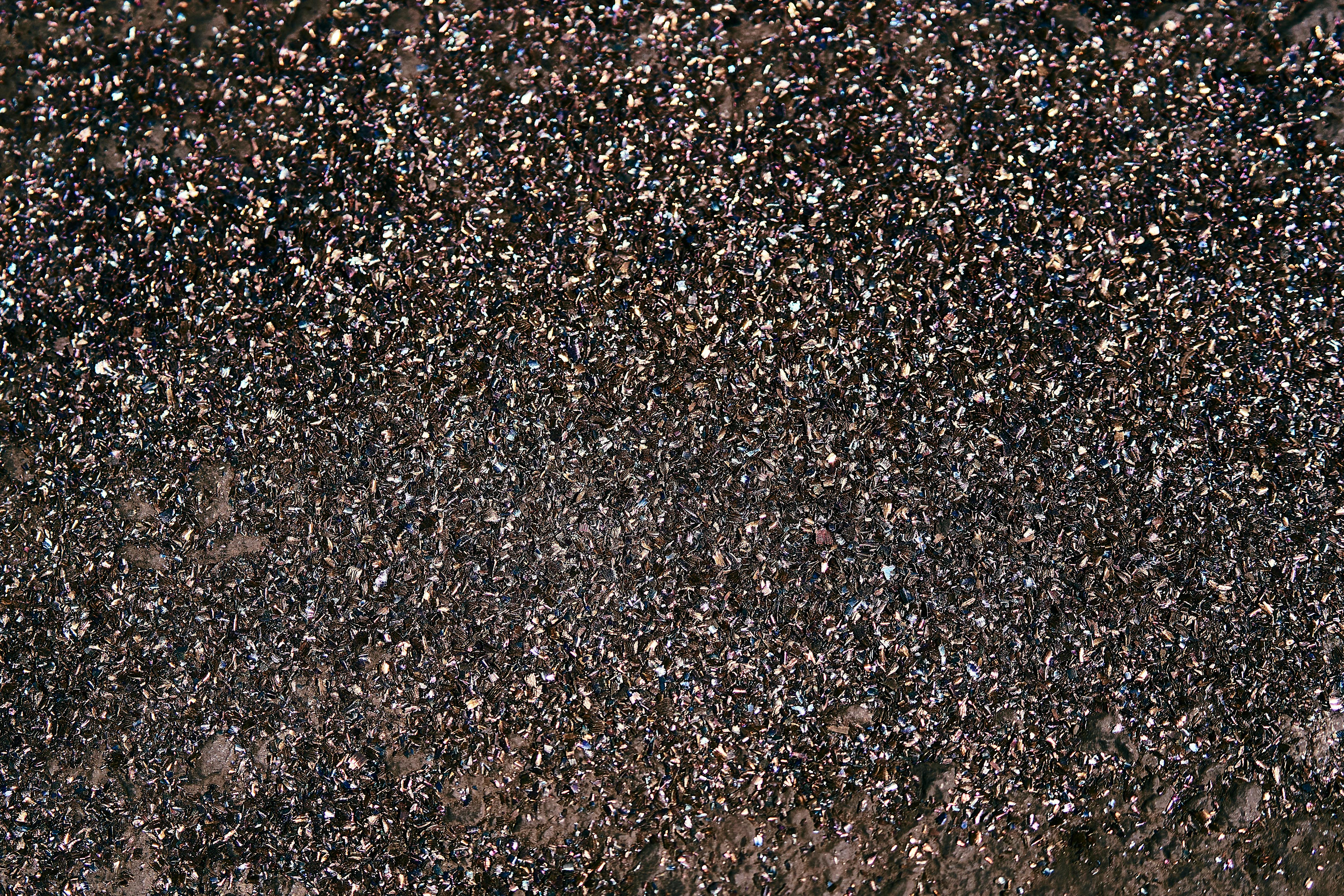 Free Detailed close-up of a shimmering textured surface, resembling glitter or minerals. Stock Photo