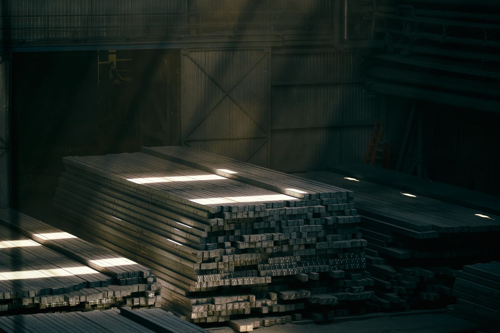 Stacks of metal sheet in an industrial warehouse