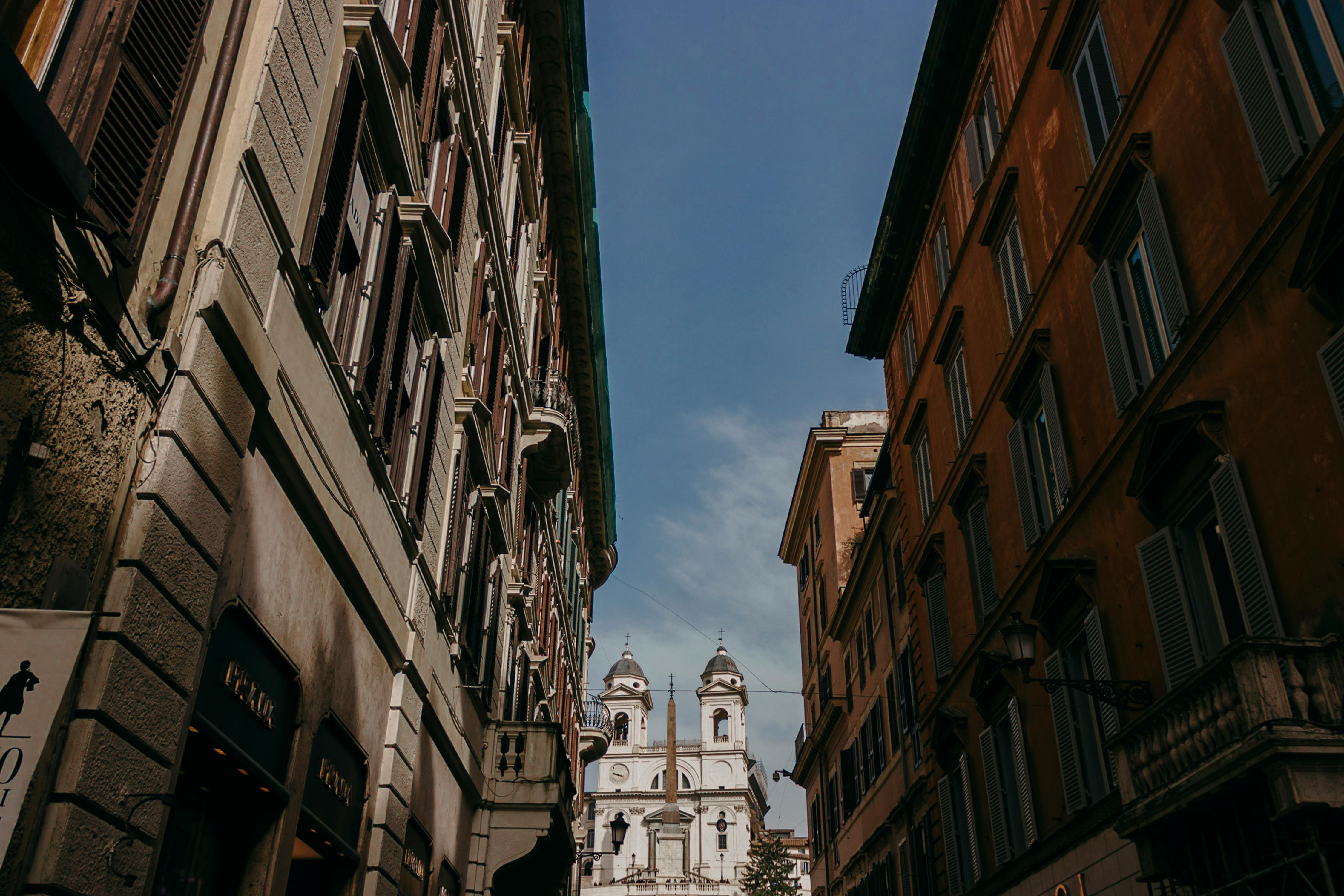 Free Captivating view of historic Roman architecture leading to a landmark church. Stock Photo