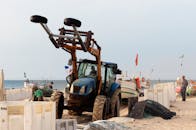 Tractor on Portuguese Beach with Fishing Boats