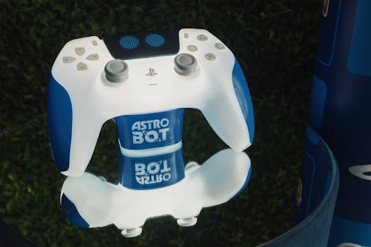 Dual-tone gaming controller with reflection, branding, and nature backdrop.