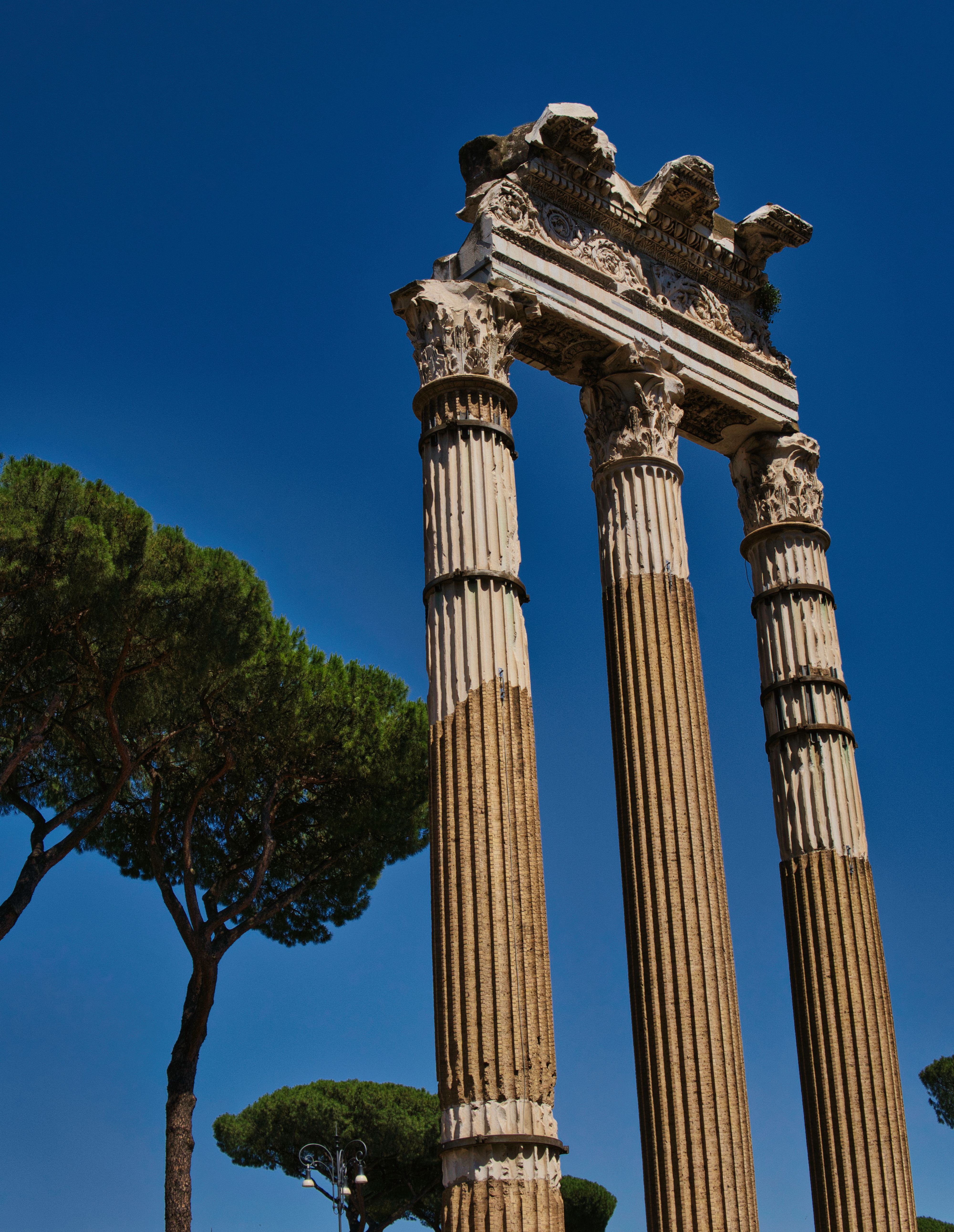 Majestic Ancient Roman Columns Against Blue Sky · Free Stock Photo