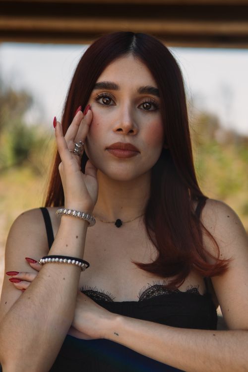 Free A captivating portrait of a young woman in León, México with a thoughtful expression. Stock Photo