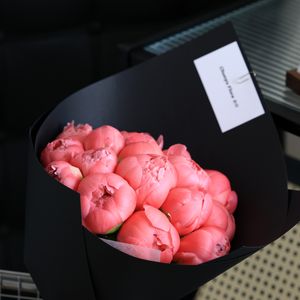 Pink peony bouquet in black wrap