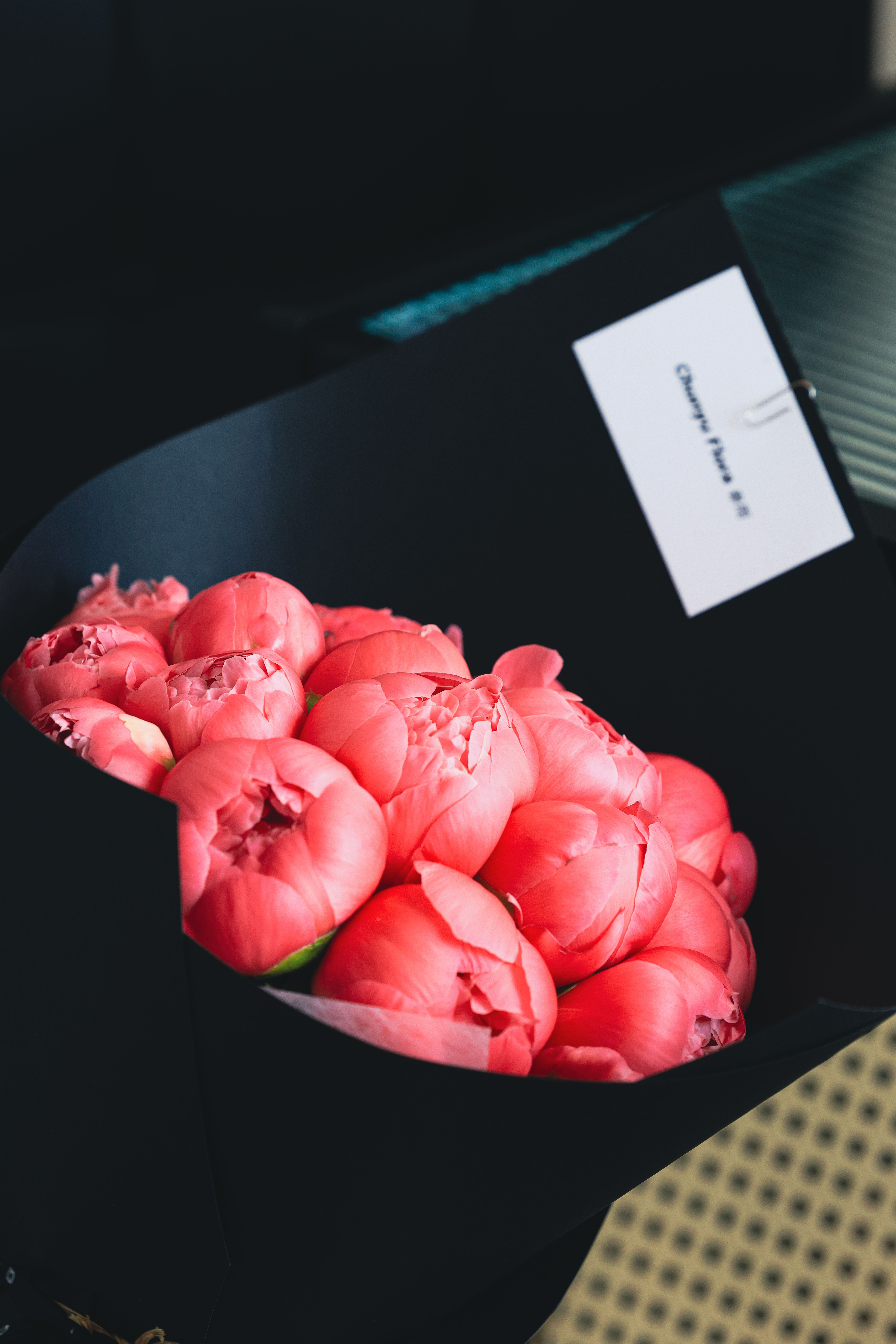 Pink peonies wrapped in black paper