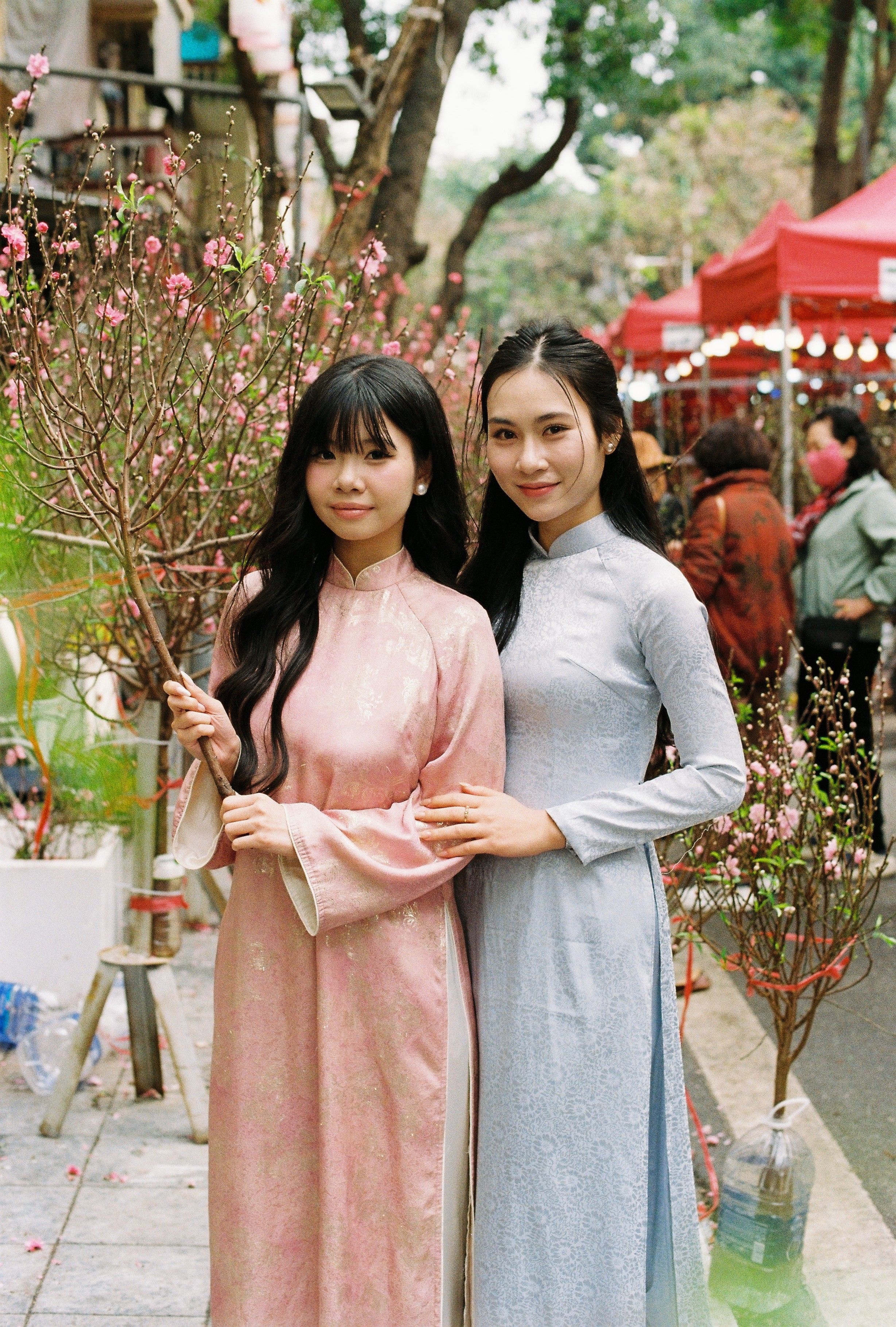 Two Women in Traditional Dresses at Street Festival · Free Stock Photo