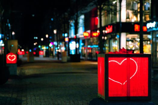 Heart-shaped lanterns illuminate Jönköping streets at night, creating a romantic urban atmosphere.