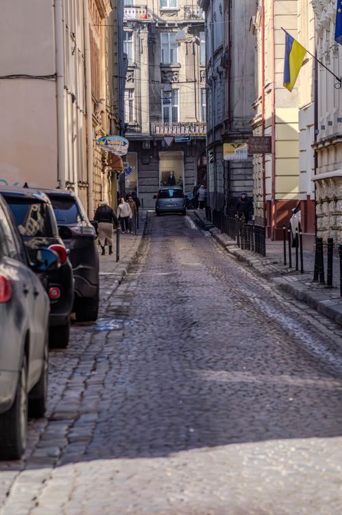 Free A picturesque cobblestone street in the heart of Lviv, featuring classic architecture and a vibrant atmosphere. Stock Photo