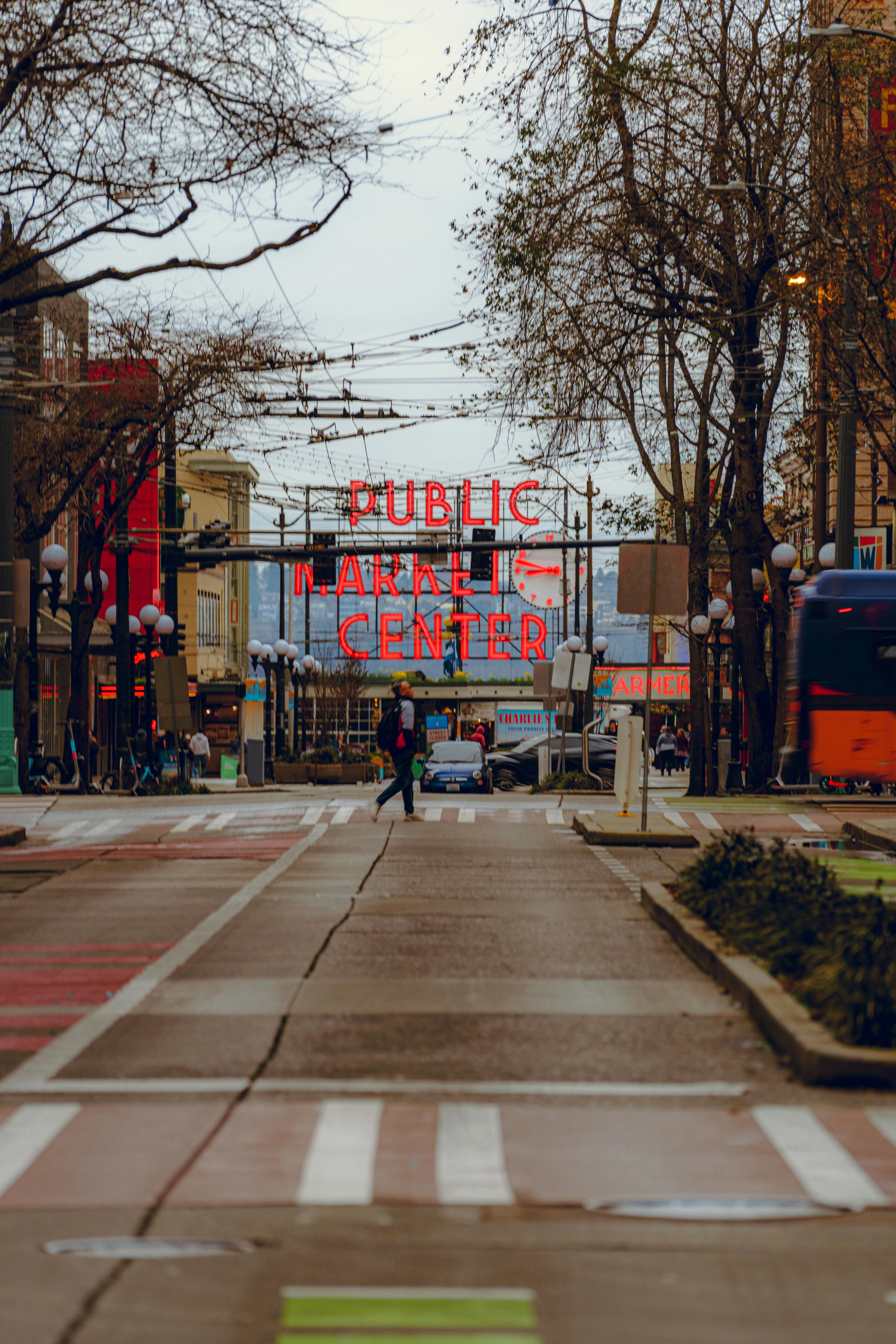 Free Pike Place Market Center vibrant street view at dusk, Seattle iconic landmark. Stock Photo