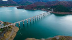 Scenic Bridge Over Riaño Reservoir at Sunset
