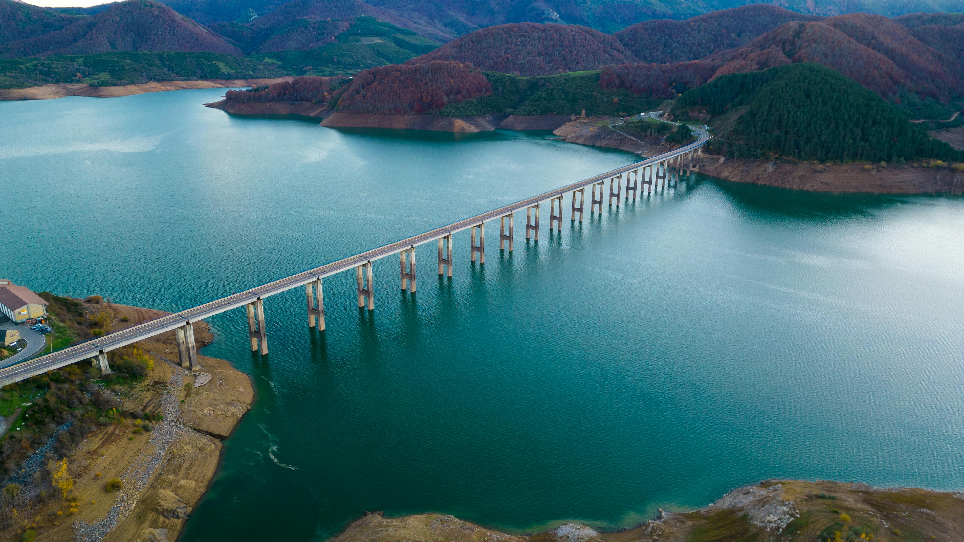 Scenic Bridge Over Riaño Reservoir at Sunset