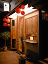 Cozy Nighttime View of a Lantern-lit Shopfront