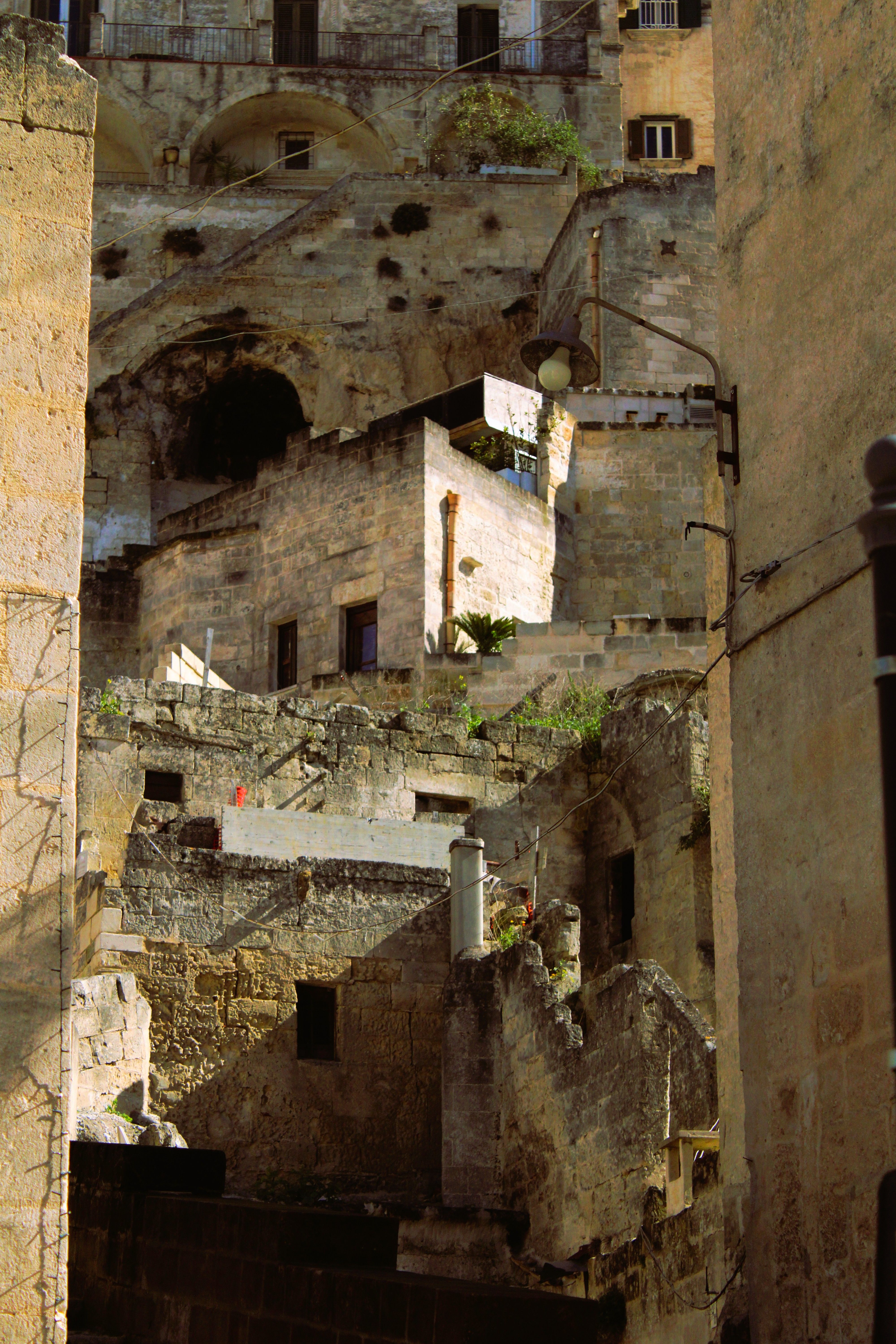 A view of ancient stone architecture in Matera, showcasing historic charm under daylight.