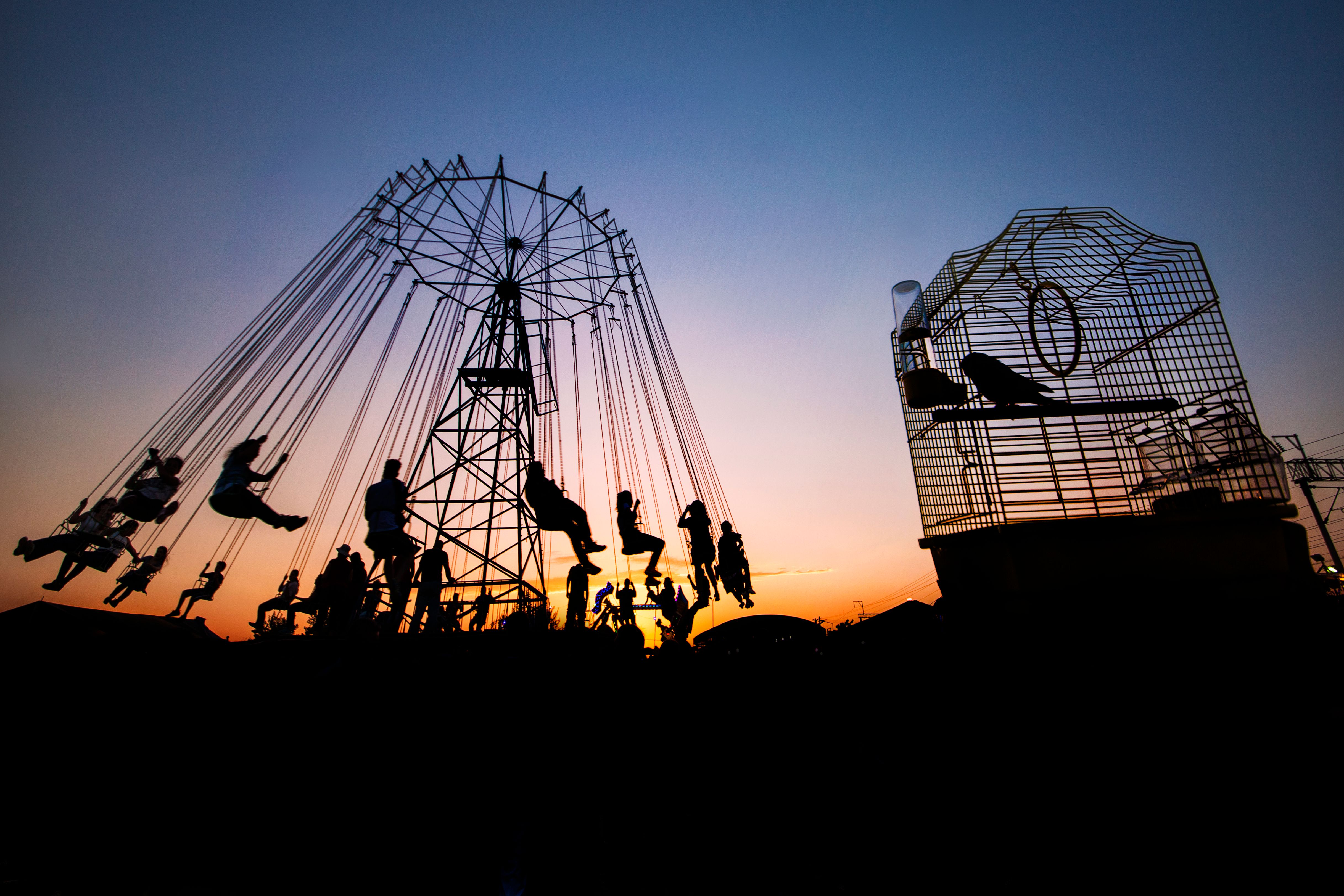 Silhouette of Carnival Rides at Sunset · Free Stock Photo