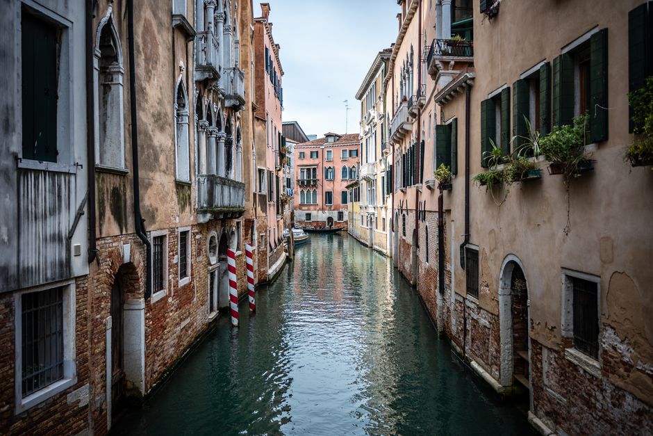 Idyllic view of Venice's canal with historic buildings lining the waterway.