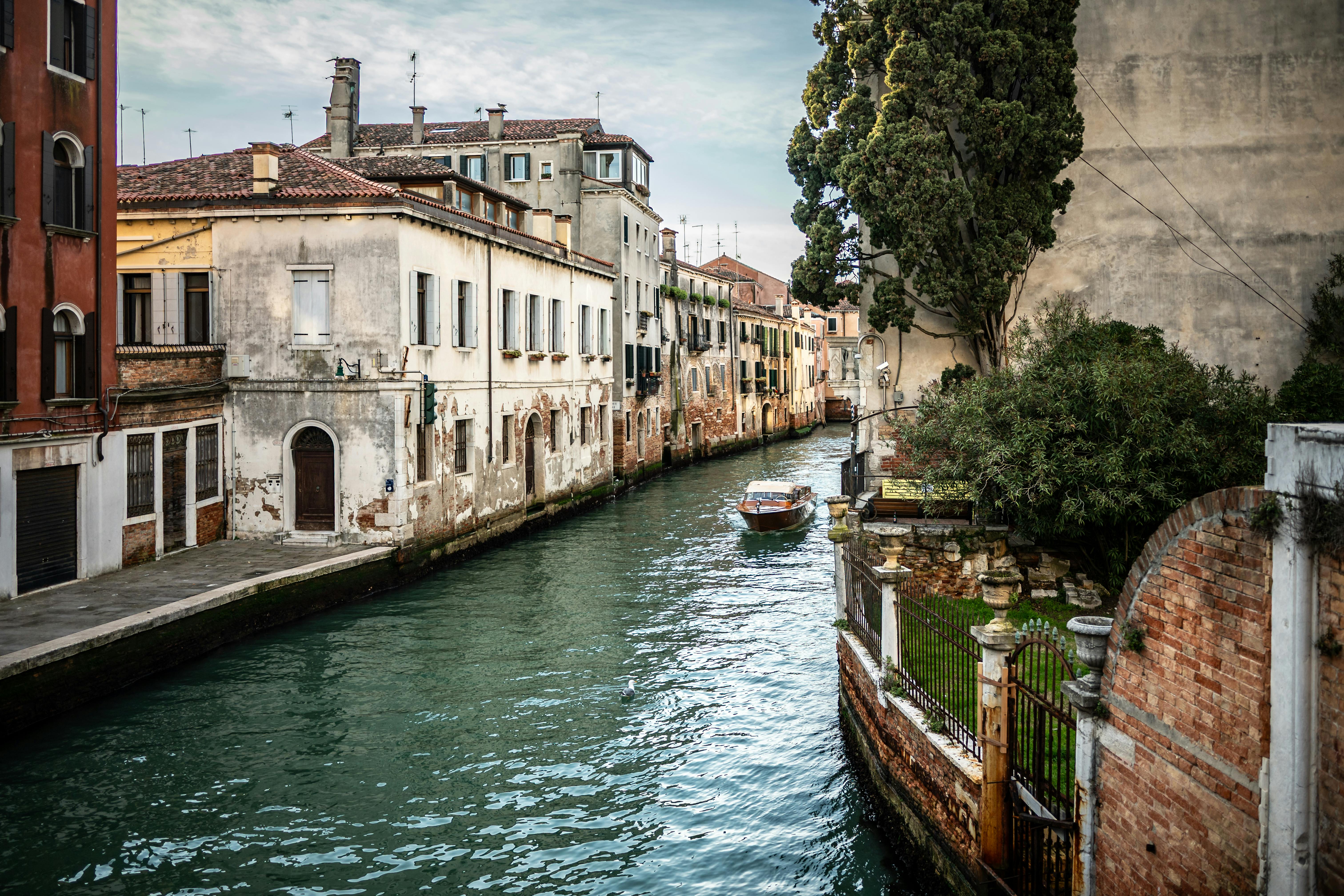 Quaint canal view with classic Italian architecture in Venice, Italy.