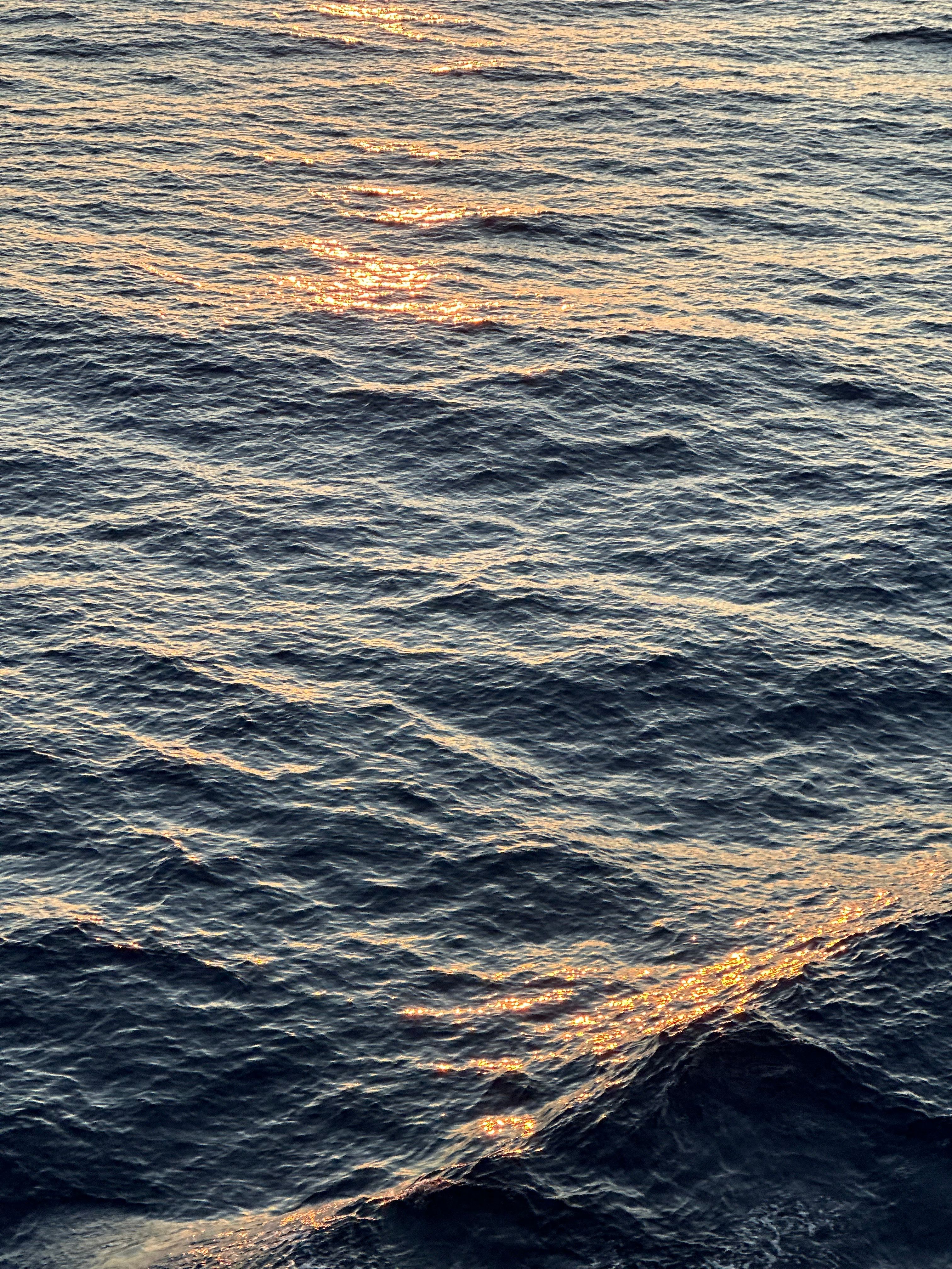 Golden Sunset Reflection on Ocean Waves · Free Stock Photo
