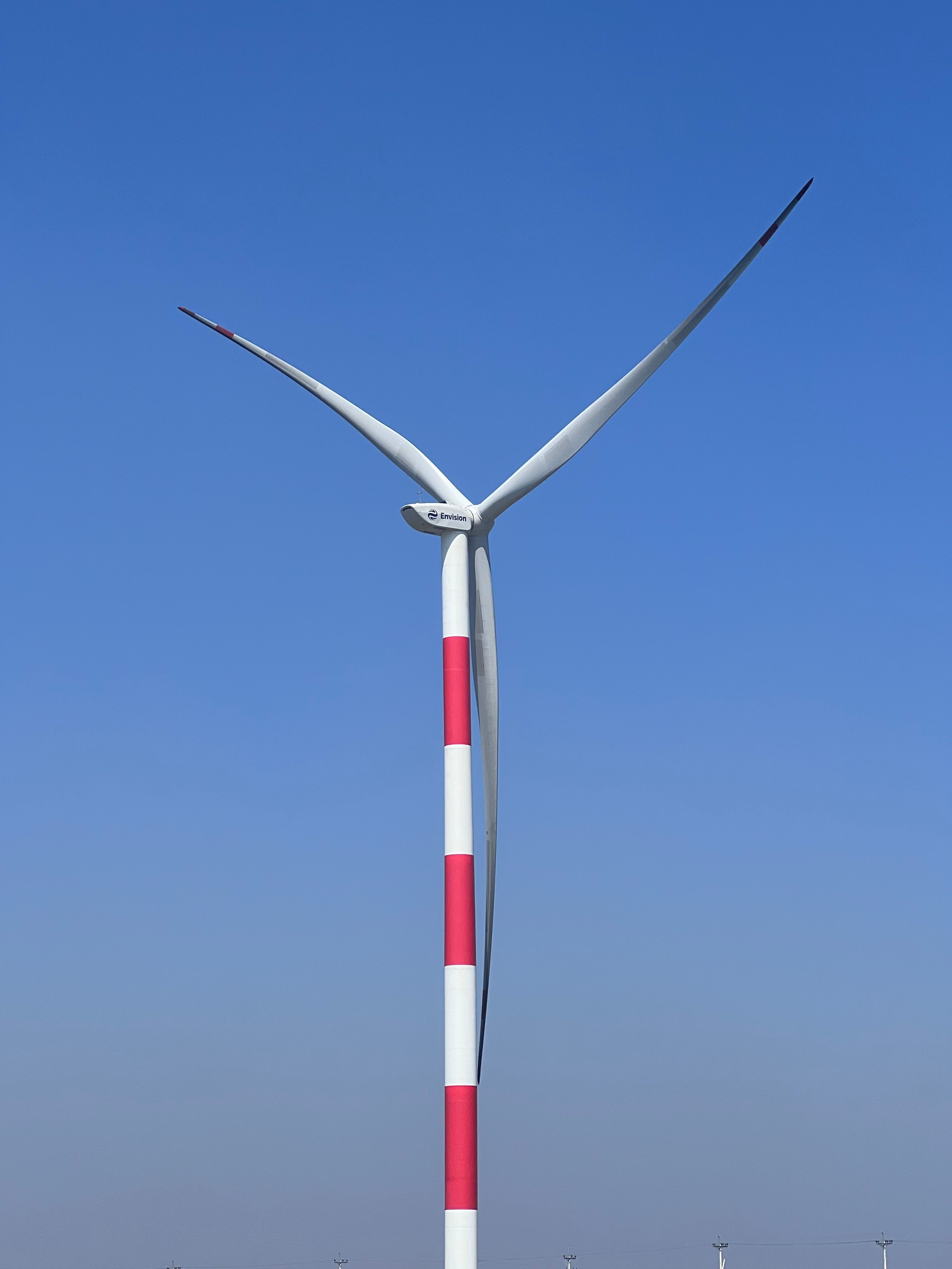 Tall Wind Turbine Against Clear Blue Sky · Free Stock Photo
