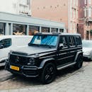 Luxury Black SUV Parked in Urban Setting