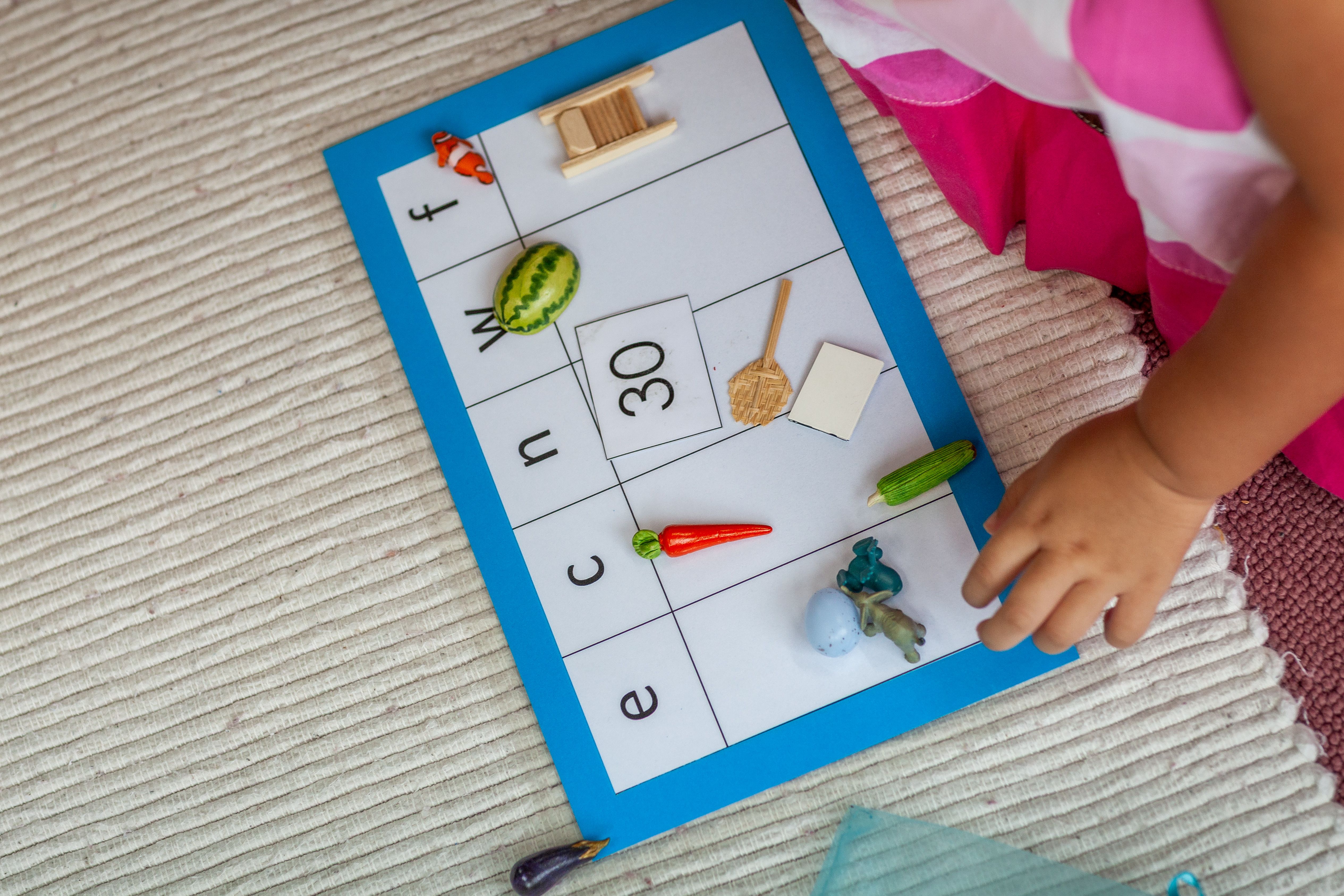 Child Engaging with Montessori Educational Materials · Free Stock Photo