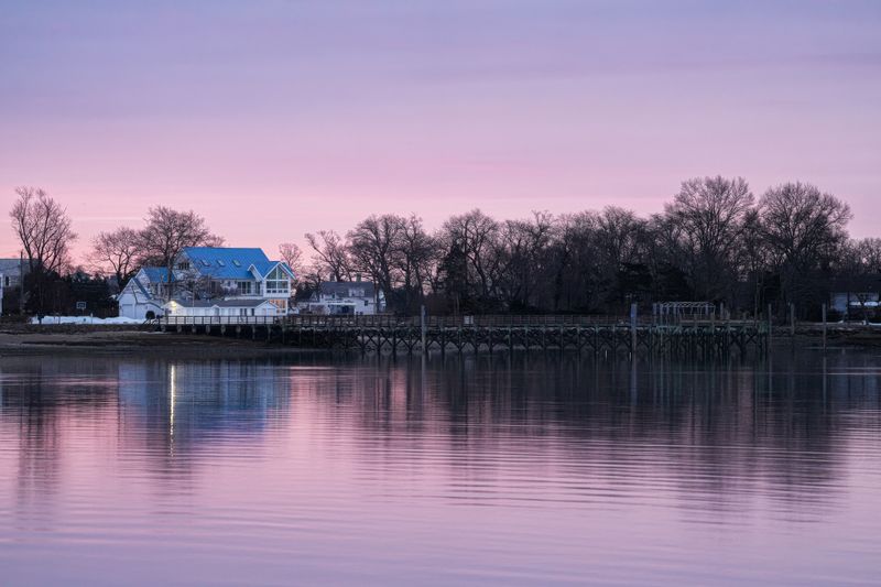 Pink dusk reflected on a still lake — Cara Denison on Pexels