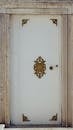 White Door with Ornate Golden Details