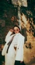 Stylish Woman in White Suit with Sunglasses