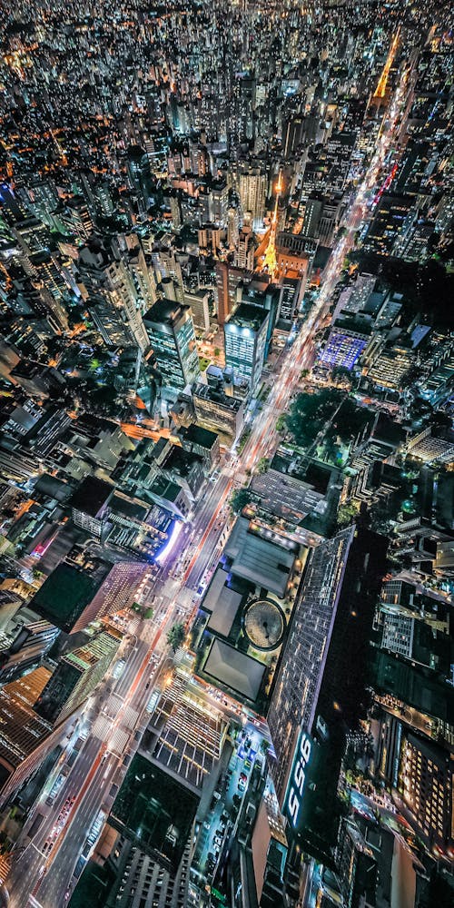 Aerial Shot Of City Buildings During Night Time