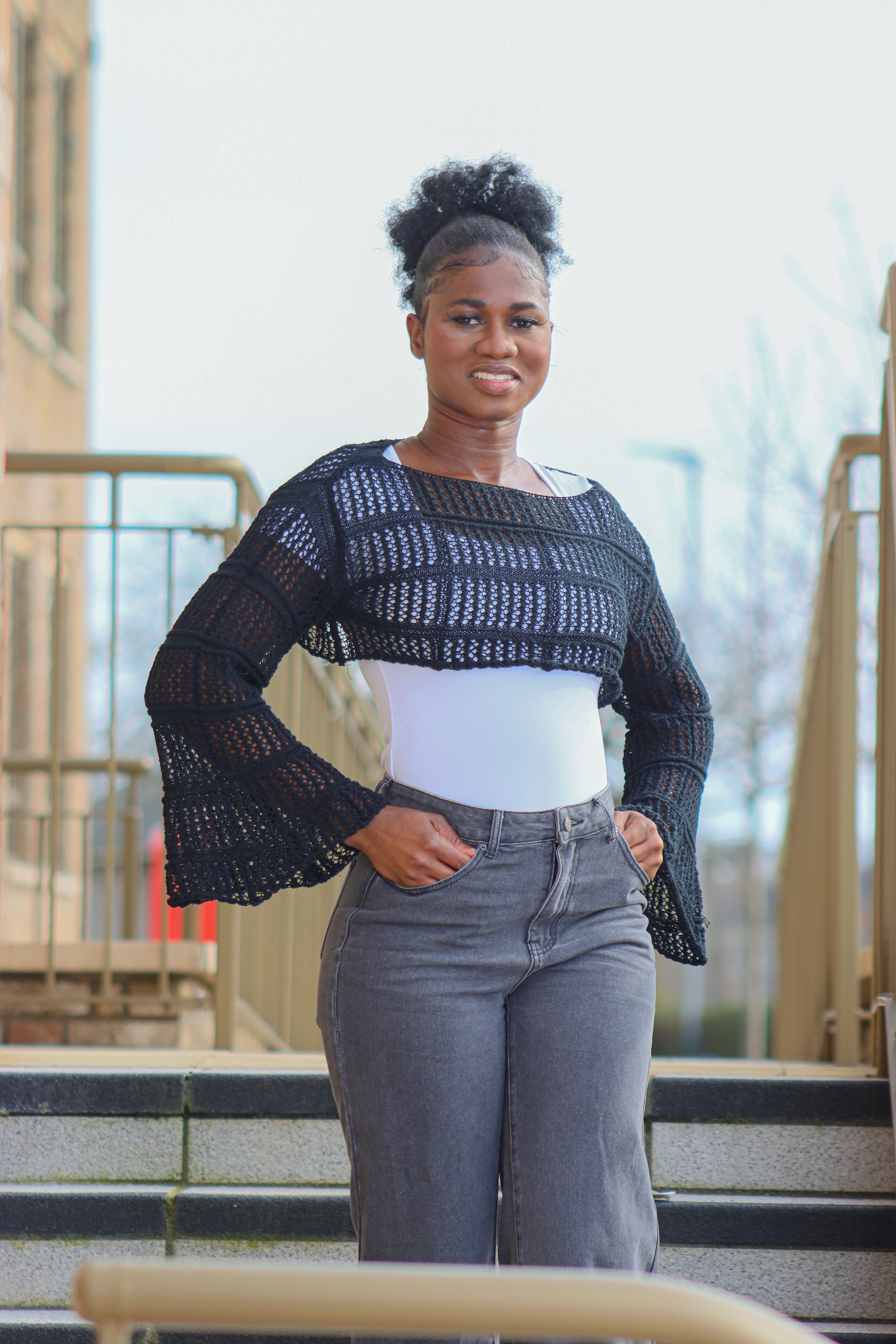 Stylish Woman Posing Outdoors in Urban Setting · Free Stock Photo