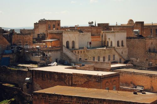 Free A view of the historic stone rooftops and architecture in Mardin, Türkiye. Stock Photo