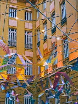 Vibrant geometric art installation near a classic building in Belo Horizonte, Brazil.