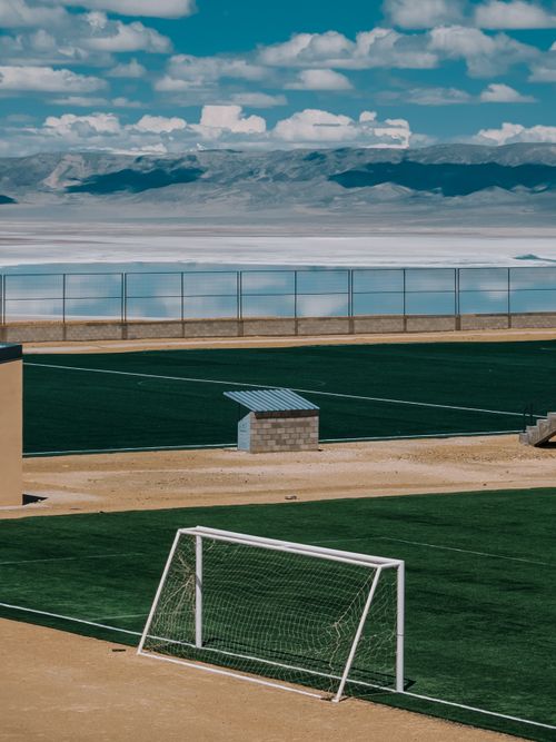 Free A scenic soccer field in Olaroz Chico, Jujuy, Argentina, with stunning mountains. Stock Photo
