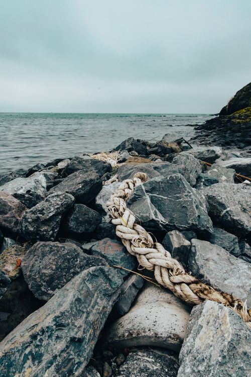 Weathered And Rugged Rope Coastal Rocks with Weathered Rope On the Shore · Free Stock Photo