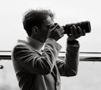 Black and White Portrait of Photographer in Action