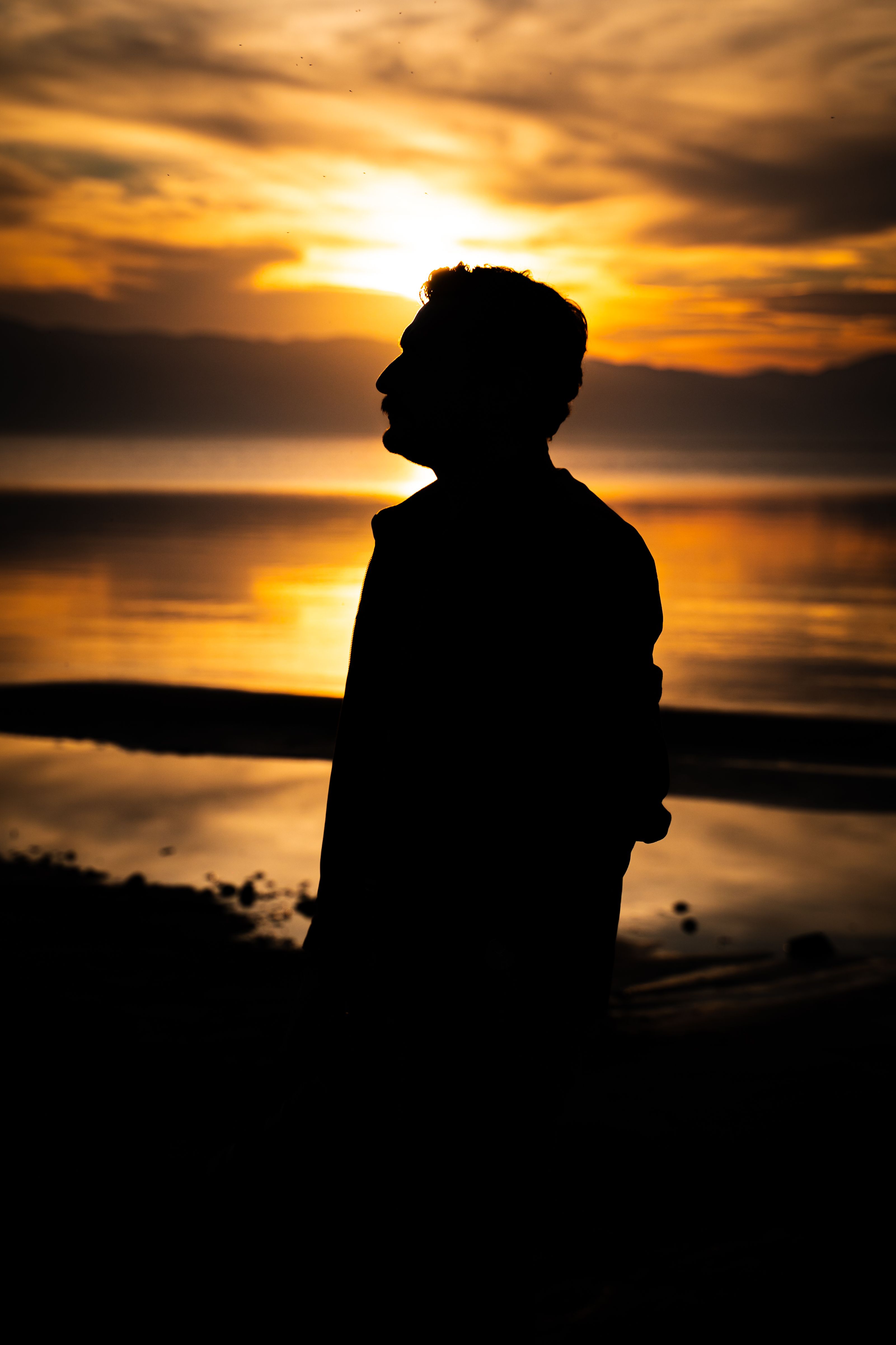 Silhouette of a Man at Sunset on the Beach · Free Stock Photo