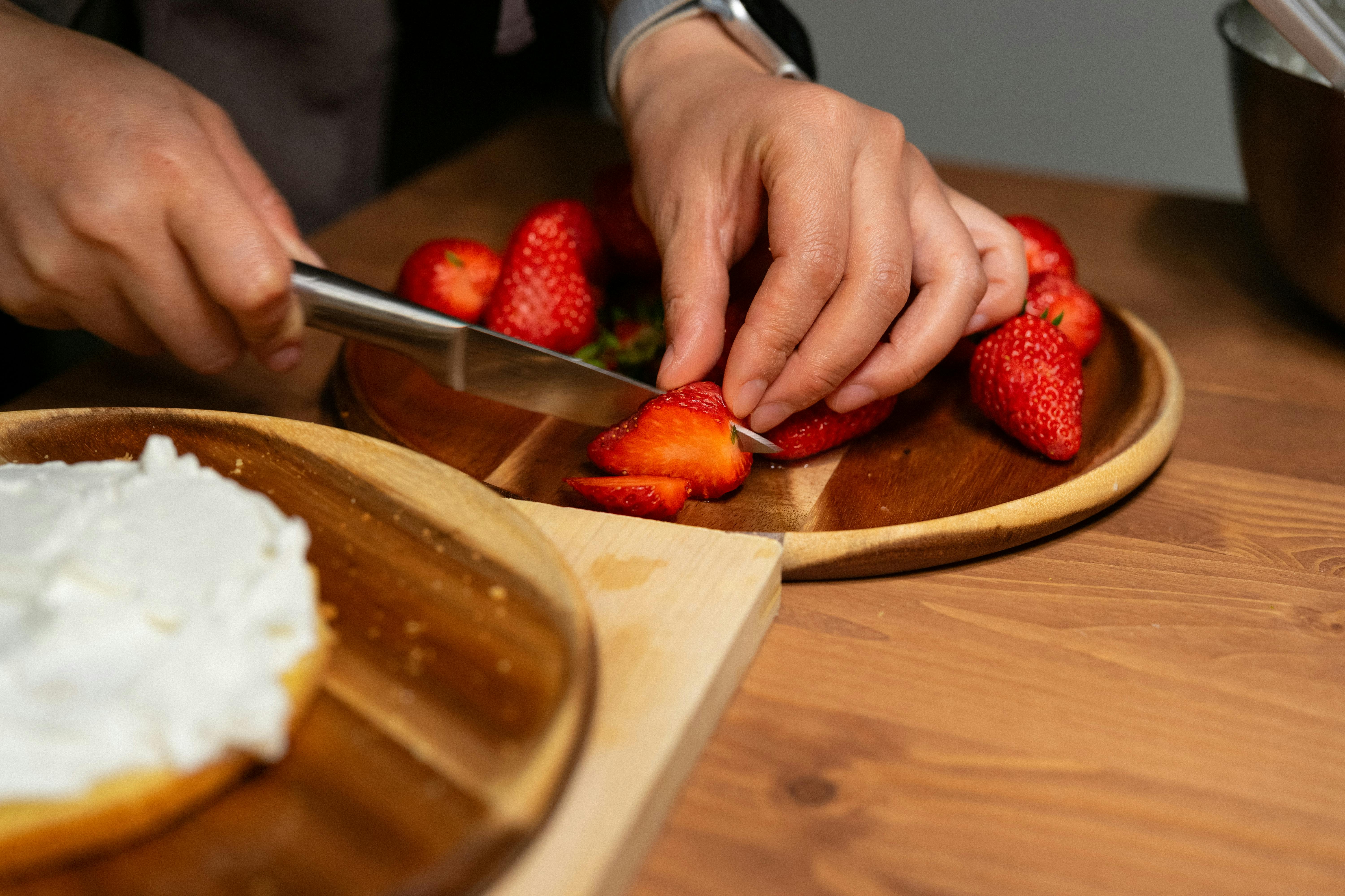 A Person dicing Red Strawberry