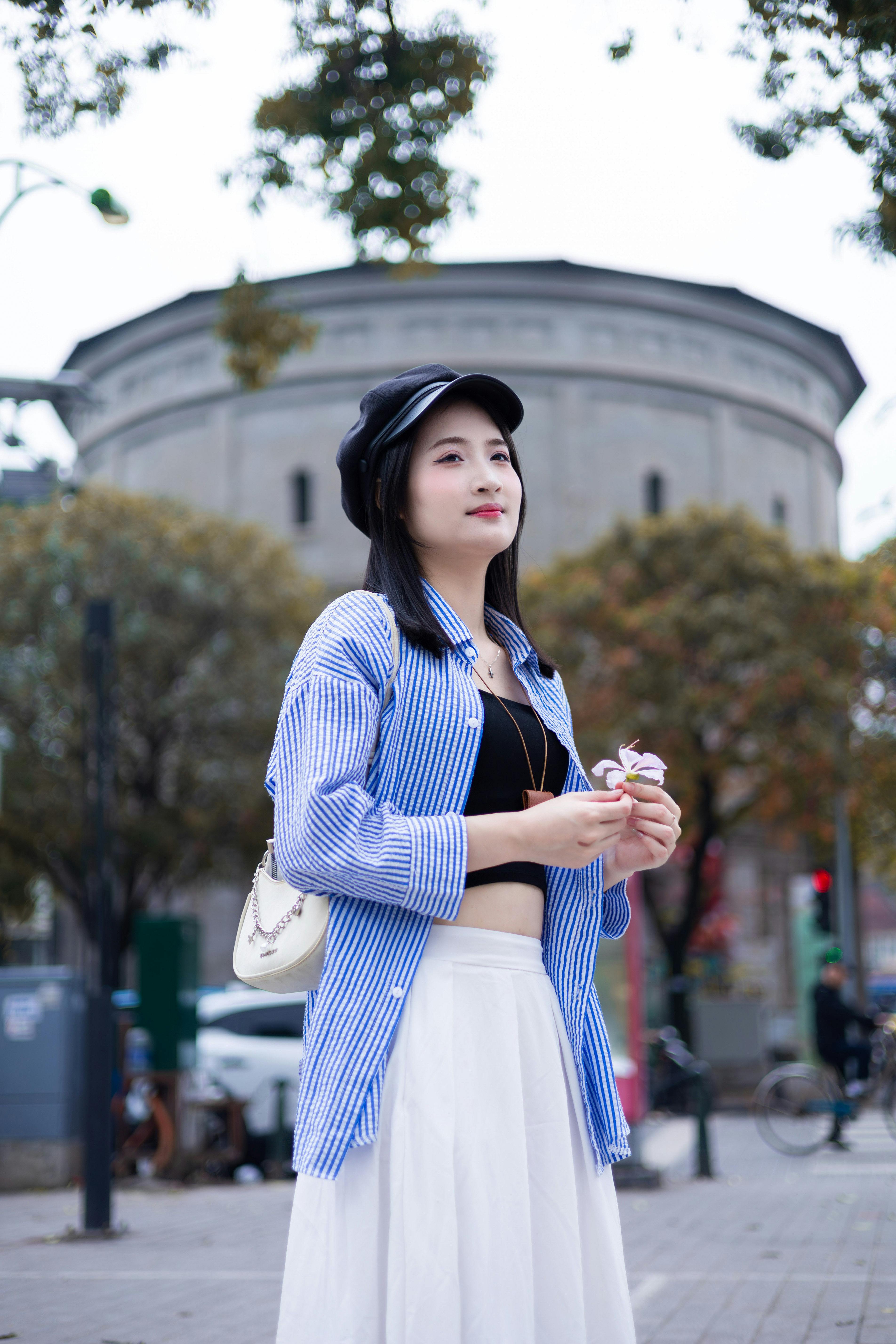 Stylish Woman Near Historic Hà Nội Landmark