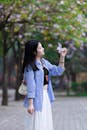 Young Woman Enjoying Spring Blossoms in Hanoi