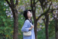 Young Woman Enjoying Nature in Hanoi Park