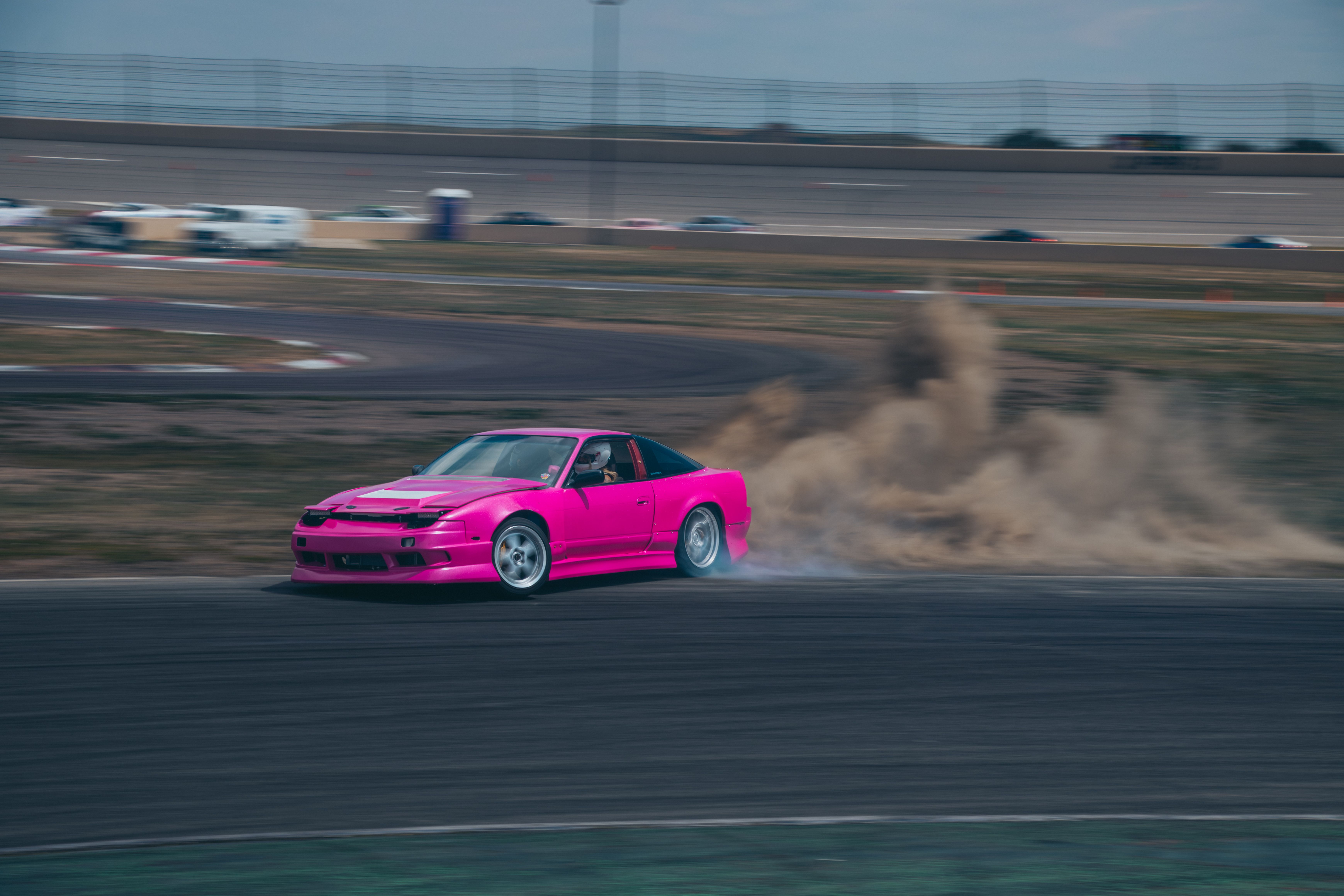 Dynamic Pink Car Drifting on Race Track · Free Stock Photo