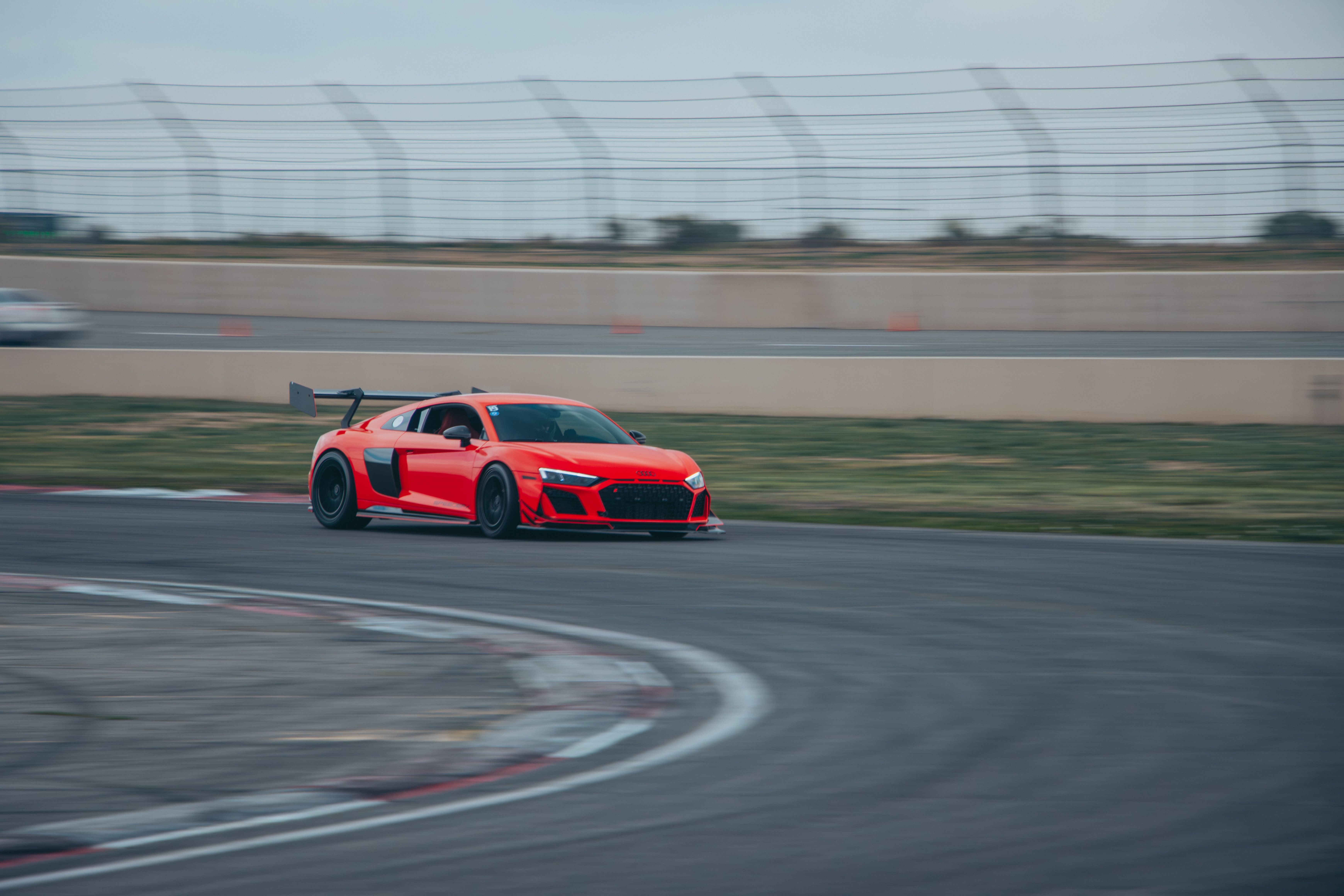 Red Sports Car Racing on Track in Colorado · Free Stock Photo