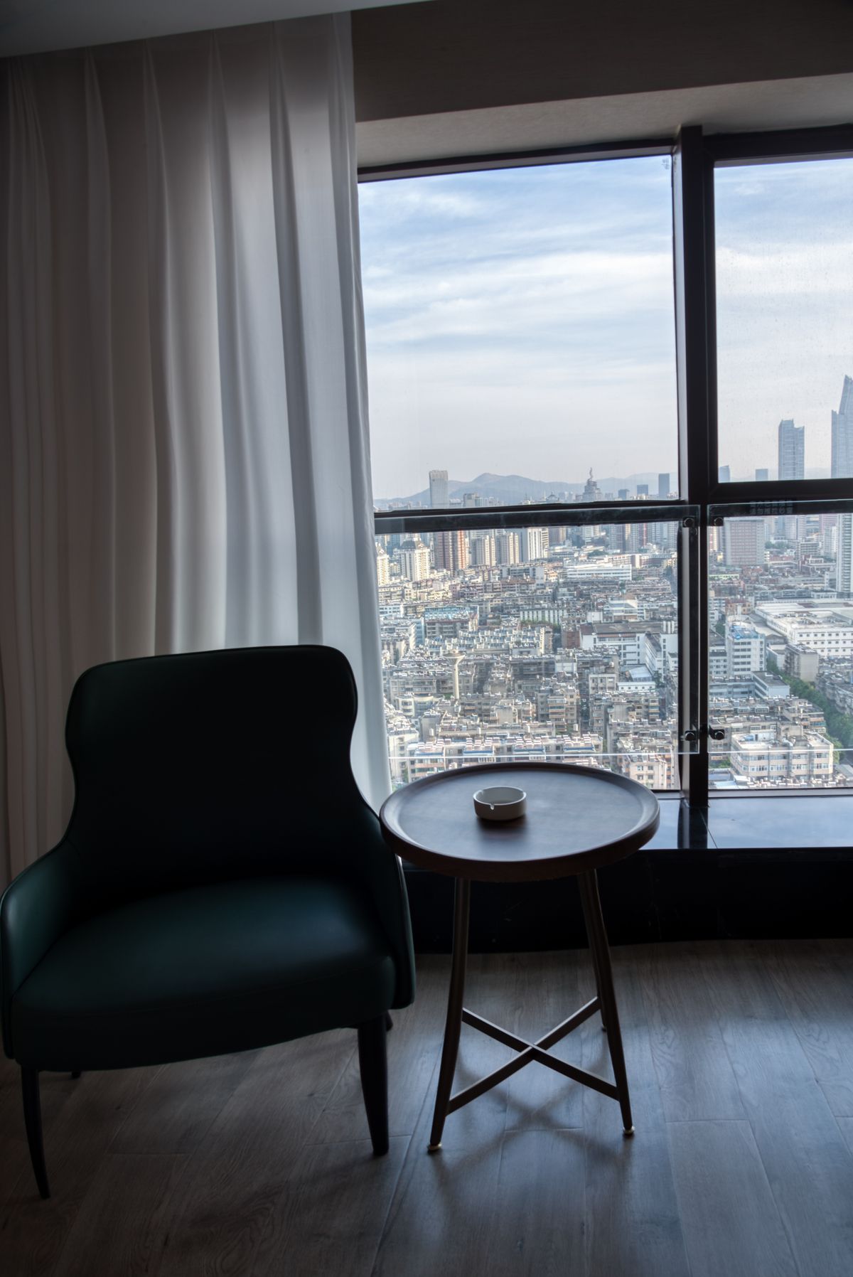 Contemporary suite with panoramic skyline and mountain view